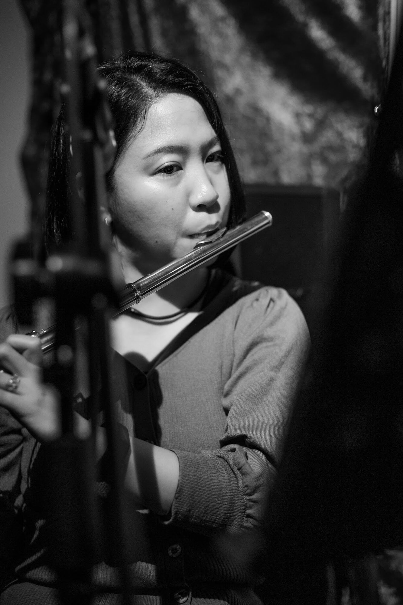Black and white: a woman playing the flute