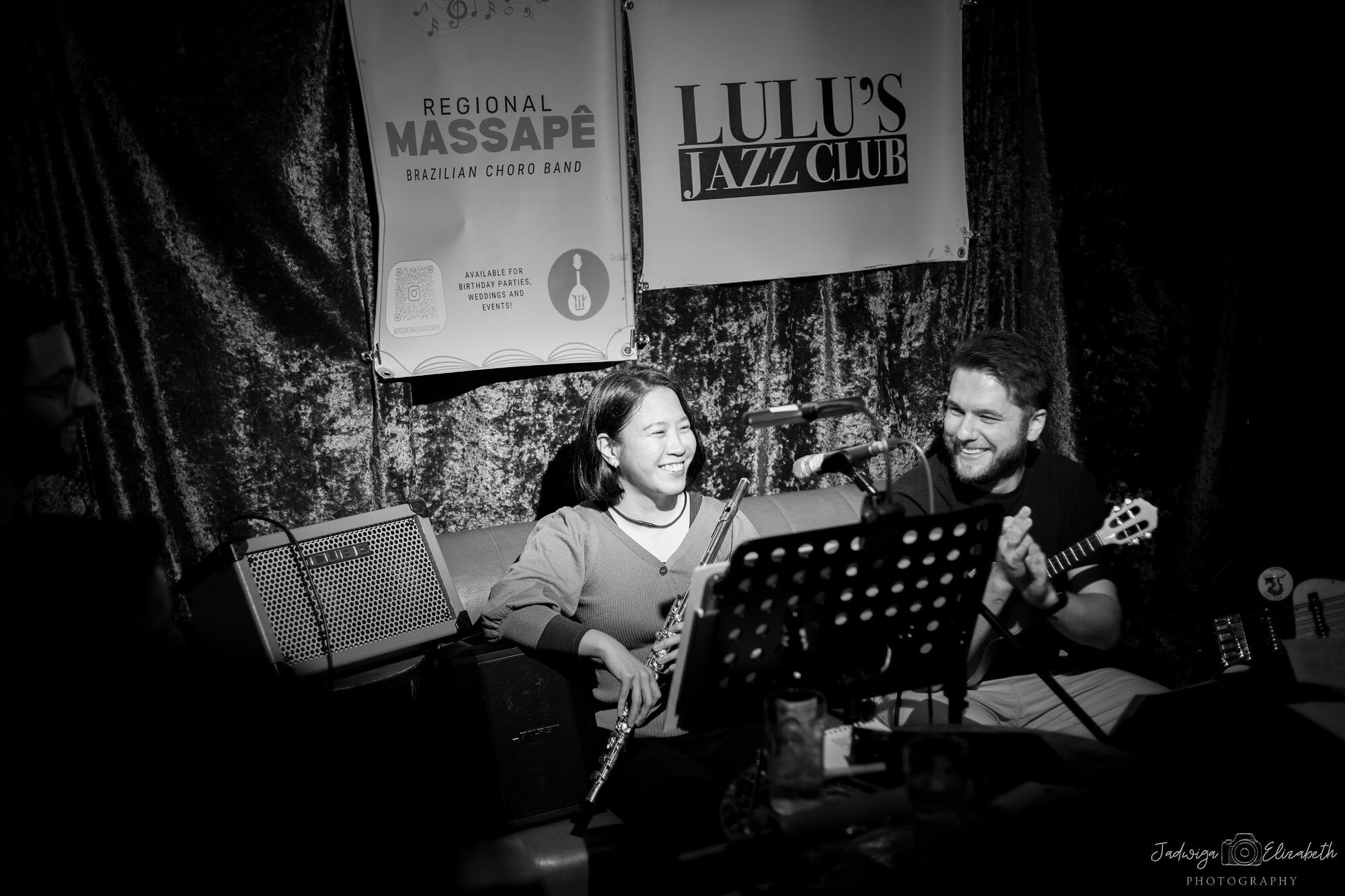 Black and white: musicians on a small stage