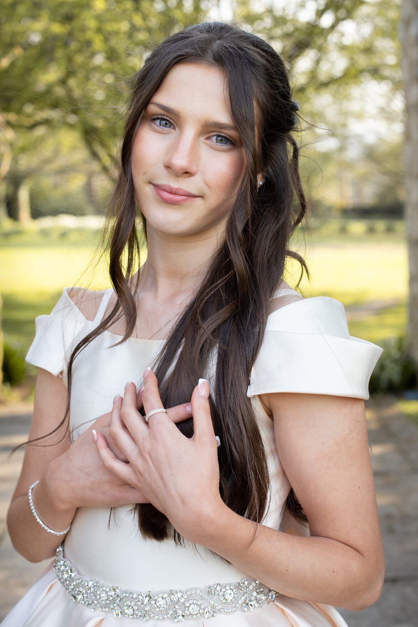 Young woman in a white dress, outdoors