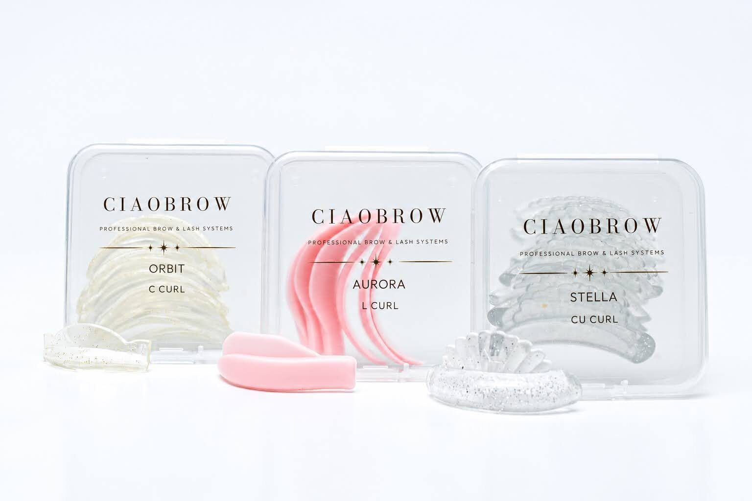 Three boxes of brow products on white